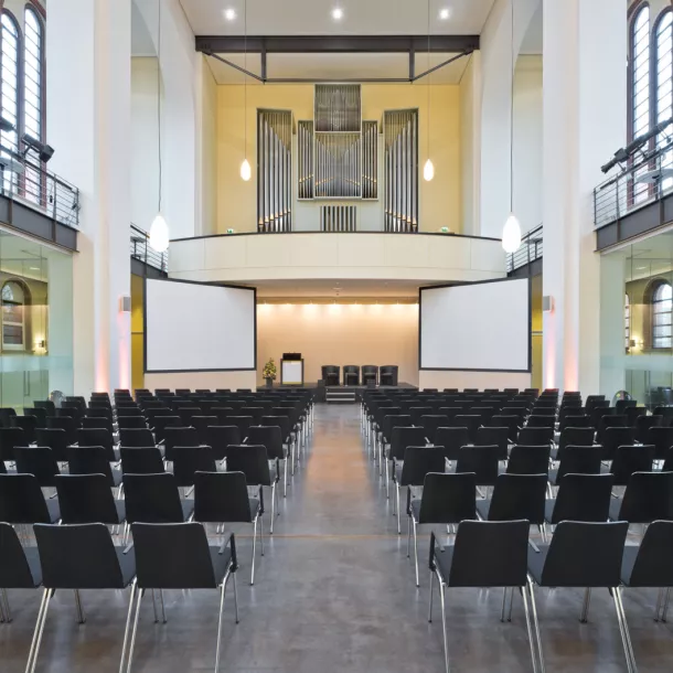 Hall on the ground floor of the Umweltforum with cinema seating